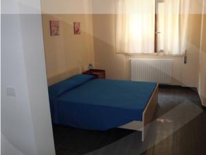 A bed or beds in a room at Un Posto Al Sole