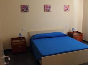 A bed or beds in a room at Un Posto Al Sole
