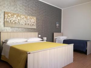 En eller flere senge i et værelse på La casa di Bice