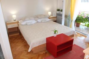 Rúm í herbergi á Guesthouse Marta