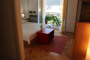 Rúm í herbergi á Guesthouse Marta