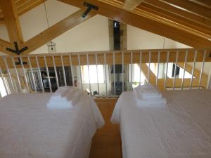 En eller flere senge i et værelse på Casa Retiro de Lisei