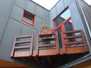 a balcony with a potted plant on a building at Brigitte & Alain in Brussels