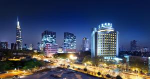 a view of a city at night with buildings at Lakeview Xuanwu Hotel in Nanjing