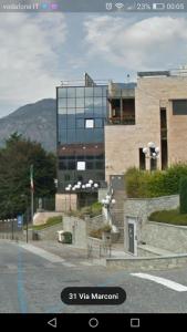 a building on the side of a street at mansarda roulette in Saint Vincent