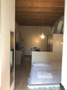 Postel nebo postele na pokoji v ubytování MyRoom Città Alta 1