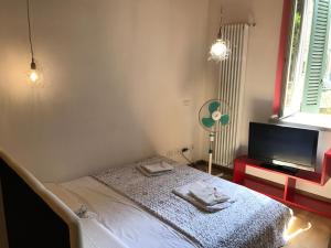 Postel nebo postele na pokoji v ubytování MyRoom Città Alta 1