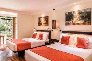 two beds in a hotel room at The Warwick Fiji in Korolevu