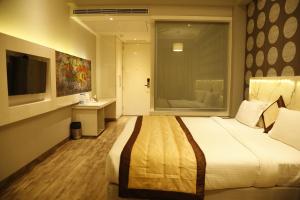 Posteľ alebo postele v izbe v ubytovaní Hotel Orange