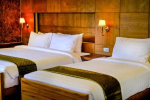 Postel nebo postele na pokoji v ubytování Naiyang Park Resort - SHA Extra Plus