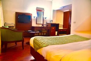 Postel nebo postele na pokoji v ubytování Hotel Sepal