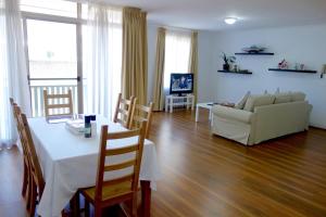 a living room with a table and a couch at Kingston Comfy Apartment in Kingston 