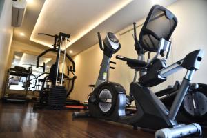 a gym with several exercise bikes in a room at Hotel Sepal in Bathinda