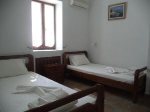 Posteľ alebo postele v izbe v ubytovaní Ilis Villas
