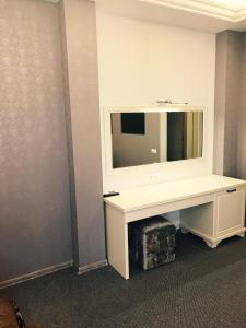 TV a/nebo společenská místnost v ubytování Central Hotel