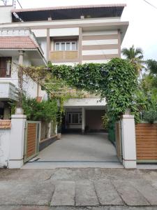 a house with an archway in front of it at Fort Abode in Cochin