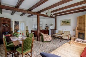 a living room with a table and chairs at Casa Bunicii - Bran Sohodol in Sohodol