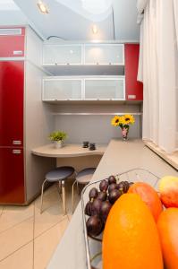 a kitchen with a bunch of fruit on a counter at Patio Mare in Sopot