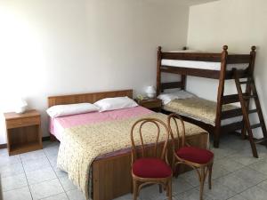 Postel nebo postele na pokoji v ubytování Hotel Cavaria