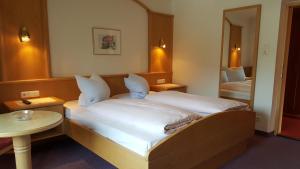 מיטה או מיטות בחדר ב-Gästehaus Wallner