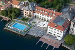 an aerial view of a building with a swimming pool at Hotel San Rocco in Orta San Giulio