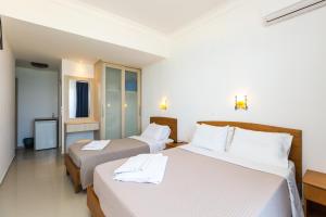 Katil atau katil-katil dalam bilik di Poseidon Hotel