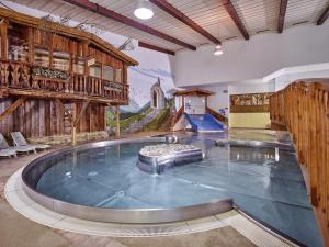a large indoor swimming pool in a house at Appartement Posthäusl in Sölden