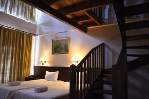 Posteľ alebo postele v izbe v ubytovaní Olvios Hotel
