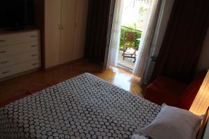 Rúm í herbergi á Guesthouse Marta