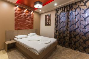 Letto o letti in una camera di Green Palace Hotel