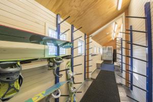 a hallway of a house with skis on the wall at TERAMA Ski Lodge in Mount Buller