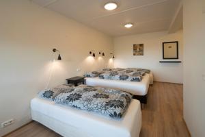 Letto o letti in una camera di Guesthouse Storu-Laugar
