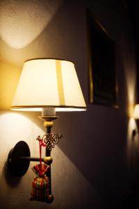 a lamp on a lamp post in a room at Casa Wagner in Braşov
