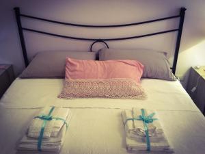 En eller flere senge i et værelse på B&B Maison Civico 13