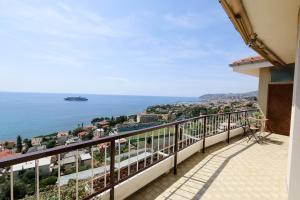 a balcony with a view of the ocean at Casa Bonita in Sanremo