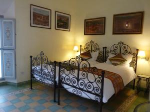 Postel nebo postele na pokoji v ubytování Riad Noos Noos & Spa