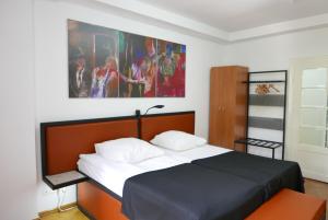 Postel nebo postele na pokoji v ubytování Rooms Bytom