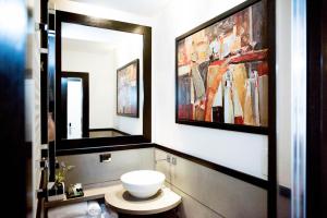 a bathroom with a toilet and a large mirror at Le Stanze Di Federica in Rome