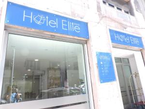 a blue sign on the side of a building at Hotel Elite Palermo Centro in Palermo