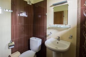 a bathroom with a toilet and a sink at к-г Луна к-с Лонгоза комплекс Лонгоза in Byala +74 photos