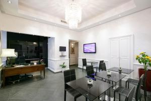 a dining room with a table and a desk at Le Stanze Di Federica in Rome