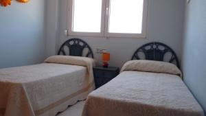 Postel nebo postele na pokoji v ubytování Apartamento En Daimus Con Vistas Al Mar