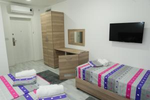Postelja oz. postelje v sobi nastanitve Atina Lux Hostel