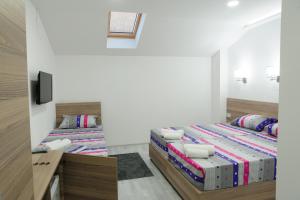 Postelja oz. postelje v sobi nastanitve Atina Lux Hostel