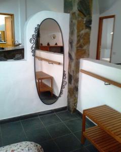a mirror on a wall in a room at Apartamentos Villa María in Los Llanos de Aridane