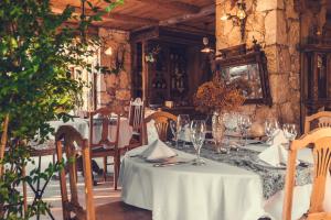 a dining room with a table with a white table cloth at Fidanka Hotel in Kalkan