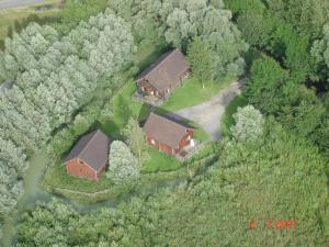 an aerial view of a house in the woods at Chic Chalet in Quend Plage les Pins with Barbecue in Quend