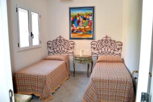 A bed or beds in a room at Villa 19