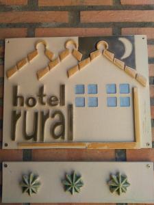 a cake shaped like a house with the words hotel rival at Hotel Rural Los Perales in San Vitero