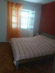 Rúm í herbergi á Apartman Adrian I David
